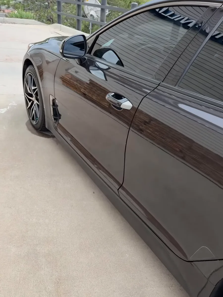 Reflections on a finished black vehicle